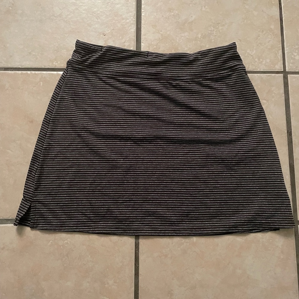 Black mini skirt with a small slit